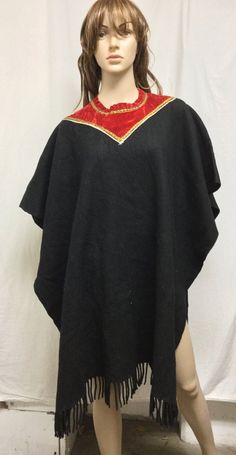 "Poncho top,Indian Poncho,Ethnic Large,Poncho ,Black ,Red Velvet collar, Fringed Measurements\" Width 35\" Length 38\" Fringe 2 1/2\" Good condition J 477 Poncho top,Indian Poncho,Ethnic Large,Poncho ,Black ,Red Velvet collar, Fringed" Traditional Black Cape For Festival, One Size Black Cape For Festival, Traditional Black Festival Cape, Traditional Black One-size Poncho, Festival Black Embroidered Poncho, Red Bohemian Poncho With Fringe, Black Bohemian Poncho One Size, Black Fringe Poncho Shawl, Poncho Tops