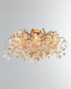 a chandelier with many glass pieces hanging from it