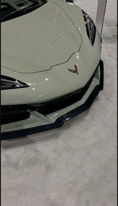 the front end of a white sports car