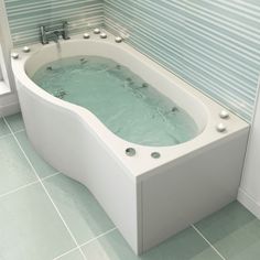 a white bath tub sitting on top of a tiled floor