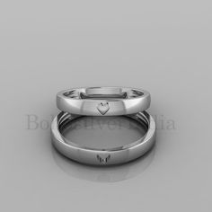 two wedding bands with hearts on them