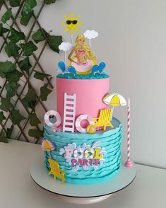 there is a cake that has been decorated with the theme of barbie and beach chairs