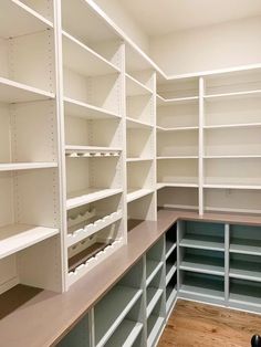 empty white shelves in the corner of a room