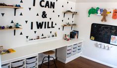 a white desk topped with lots of drawers under a wall mounted chalkboard that says i can and i will