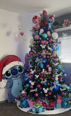 a christmas tree decorated with blue and red ornaments