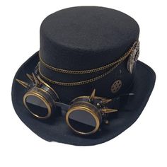 Get inventive with your next cosplay outfit with our Steampunk Inventor Top Hat, a masterpiece of industrial elegance and daring innovation. This striking top hat features a timeless black canvas adorned with intricate brown, brass, and copper details. Adorned with chains that speak of adventure and exploration, gears that whisper tales of invention and progress, and goggles with spikes that evoke a sense of daring defiance, this hat is more than just an accessory; it's a statement. Whether you' Inventor Goggles, Steampunk Inventor, Steampunk Hats, Steampunk Ideas, Steampunk Hat, Brass And Copper, Masquerade Ball, Girl Cakes, Big Girl