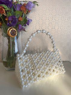 Includes short pearl handle and long gold chain. If you want silver, write a message. Chain model may vary depending on stock model. A stylish beaded bag that will become an incredible accessory for your outfits.  Handmade, this bag is high quality and unique.  It is perfect for both special occasions and to use in your daily life.  You can freely use this bag as an evening dress, with jeans or even with your suits. Also, this bag would make a perfect gift. *Christmas  *Valentine's Day  *Mother' Handheld Evening Bag With Pearl Embroidery As Gift, Handheld Pearl Shoulder Bag For Parties, Rectangular Evening Bag With Pearl Embroidery For Gift, Rectangular Pearl Shoulder Bag For Party, Rectangular Pearl Embroidery Evening Bag As Gift, Rectangular Cream Evening Bag As Gift, Rectangular Pearl Embroidery Evening Bag, Square Wedding Bag With Pearl Handle, Rectangular Cream Evening Bag Gift