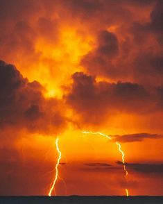 a large cloud with lightning coming out of it