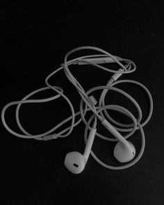 two earphones are laying on the ground