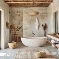 a large white bath tub sitting under a wooden ceiling