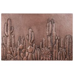 a metal plate with cactus and flowers on it