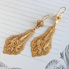 Beautifully crafted Victorian earrings circa 1895. Originally they had screw-back fittings but we replaced those with 18k shepard's hook wires. Perfect as a boho wedding accessory, as well as a signature statement, they have a seductive dance on the ear as the bottom pendant sways with the wearer's movement. Measuring approximately 3" long from top of the ear wire curve to bottom of the drop. Not marked for metal content, the earrings themselves are 16k, XRF tested to confirm, the wires are 18k. Filigree Earrings Gold, Turkish Gold Jewelry, Boho Wedding Accessories, Neck Pieces Jewelry, Gold Filigree Earrings, Victorian Earrings, Gold Jewellry, Jewelry Set Design, Fancy Jewellery Designs