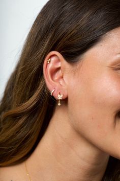 a close up of a person wearing some kind of ear piercing