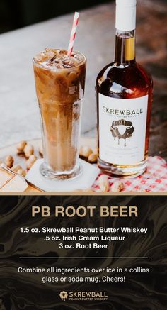 a bottle of beer sitting next to a glass filled with ice cream and nuts on a table