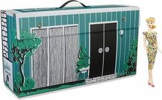 a barbie doll standing in front of a green box with doors and windows on it