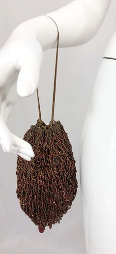 For Sale on 1stDibs - Beautiful 1920s bronze and brown fully beaded evening bag! The perfect alternative to a clutch! This rare gem features two gold metal chains, and can be Gold Bohemian Evening Bag, Aubergine Colour, Tapestry Handbags, 20s Flapper, Beaded Boxes, Handbags And Purses, Novelty Bags, Rare Gems, 1920s Fashion