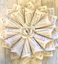 an origami flower made out of sheet music