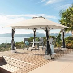 a gazebo with chairs and tables on a deck