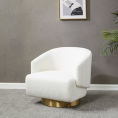 a white chair sitting on top of a carpeted floor next to a potted plant