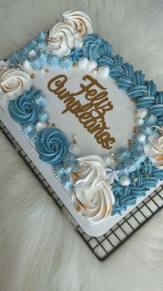 a birthday cake with frosting and icing on a cooling rack in the shape of a heart