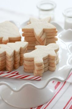 some cookies are on a plate with candy canes