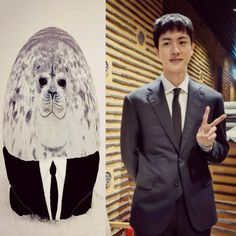 a man in a suit standing next to an image of a seal