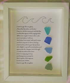 a framed poem with four pieces of glass in it