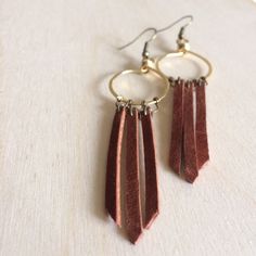 "Southwestern inspired jewelry, add some leather to your look! This pair is 4\" long and is very light weight. It is made with raw brass and it takes you back to a boho dream. You can wear them on the next music festival!! For lunch with some friends or everyday!!" Bohemian Brass Fringe Earrings, Bohemian Brass Fringe Jewelry, Bohemian Brass Jewelry With Fringe, Bohemian Brown Dangle Hoop Earrings, Brown Bohemian Dangle Hoop Earrings, Bohemian Dangle Fringe Hoop Earrings, Bohemian Fringe Dangle Hoop Earrings, Bohemian Brown Hoop Earrings For Festival, Coin Choker