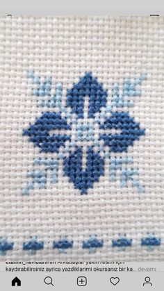 the cross stitch pattern is blue and white