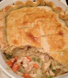 a chicken pot pie in a white dish