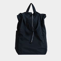 A versatile, lightweight, water-repellent bag that can be worn as a backpack, shoulder bag, or carried by hand. On-the-go Nylon Backpack With Removable Pouch, Nylon Backpack With Removable Pouch For On-the-go, Nylon Shoulder Bag With Adjustable Straps For On-the-go, Black Travel Bag With Removable Pouch For Outdoor Activities, Black Travel Bag With Removable Pouch For Outdoor, Sporty Large Capacity Nylon Backpack, Functional Travel Bag With Large Capacity, Functional Nylon Duffle Bag Backpack, Versatile Nylon Duffle Bag Backpack