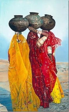 three women carrying pots on their heads in front of a body of water and sky