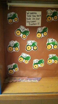 a bulletin board with tractors on it and some stickers in the back ground to help children learn how to use them