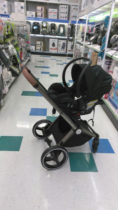 a baby stroller sitting on the floor in a store