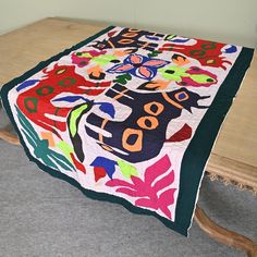 a table with a quilt on top of it