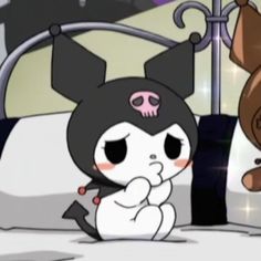 a cartoon character is sitting on a bed