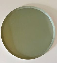 a round mirror hanging on the wall