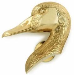 a close up of a gold duck head on a white background with clippings