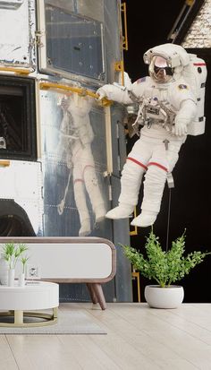 an astronaut hanging from the side of a space shuttle in front of a planter