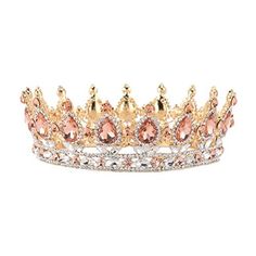 a gold and pink tiara with crystal stones on the sides, set against a white background