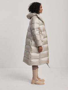 Longline with an exaggerated, oversized fit. This style is intentionally oversized. For a more tailored look, we recommend sizing down. Model is 5'10", with a 33" bust, 24" waist, 34.5" hips, and is wearing a size small. Oversized Puffer Coat, Oversized Puffer, Winter Warmers, Puffer Coat, High Collar, Long A Line, Oversized Fits, Puffer, Layering