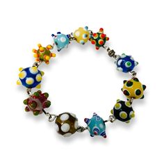 "Included are 11 vintage lampwork beads handmade, gorgeous funky chunky bracelet. These beads are made with a mix of bright colors, and each bead is covered with spikey stacks of dots in a wild array of color! These are made to fit the eurostyle bracelets, but you can also use them in other bead designs as well! The beads are about 14mm high x 24mm wide, and the hole size is 5mm Size: 7.5\" Weights: 38 grams Like new condition." Quirky Jewelry, Chunky Bracelet, Chunky Bracelets, Bird Jewelry, Funky Jewelry, Glass Bracelet, Beads Handmade, Glass Gifts, Bead Designs