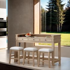 two stools and a table in front of a window with an open kitchen door