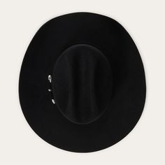 Corral 4X Buffalo Black Felt Cowboy Hat by Stetson SBCRAL-9442-07 Part of our Buffalo collection, this cowboy hat is made in the USA of high-quality, weather-resistant 4X buffalo felt. Its classic Western profile features a classic cattleman crease, a 4" brim and a 4 5/8” regular oval crown. Additional details include a leather sweatband, satin lining, and a self-matching hat band with a three-piece silver-toned buckle set, as well as a Stetson hat box. 4" Brim 4 5/8" Regular Oval Crown Cattlema Black Felt Cowboy Hat, Felt Cowboy Hat, Packable Sun Hat, Boys Cowboy Boots, Lifeguard Hat, American Flag Hat, American Buffalo, Girl Cowboy Boots, Mens Hats Fashion