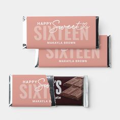 two pink and white chocolate bars with the words happy sweet sixteen written on them, sitting next to each other