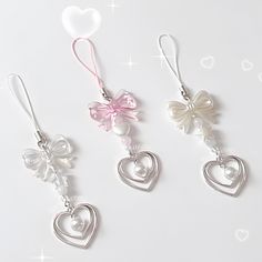 three different types of earrings with bows and hearts