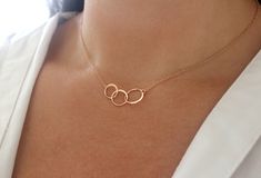 Three rose gold circles have been set on dainty yet strong rose gold chains to create this lovely modern necklace. The rose gold vermeil circles measure 22mm long and 13mm at the widest. They are fixed to rose gold filled chains and finished with a rose gold filled spring ring clasp. This necklace is made to order. Please choose your desired length upon checking out. Not quite sure? Just select an adjustable length to be sure you get the perfect fit. The necklace shown in the photos is 17 inches Dainty Rose Gold Necklace, Short Gold Necklace, Gold Infinity Necklace, Turquoise Bar Necklace, Pink Gemstone Necklace, Infinity Necklace Gold, Blue Gemstone Necklace, Interlocking Circle Necklace, Rose Gold Circle