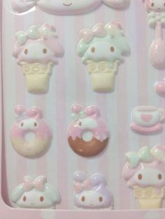 a hello kitty sticker sheet with donuts and cupcakes on it's side