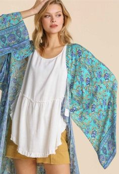 All the lovely blues in this kimono! Easy to add some instant style to your outfit.Size: M/LMaterial: 100% RayonThis kimono typically ships within 1 to 2 days.Shop Great Gifts at MainStreet Mercantile. Blue Floral Print V-neck Kimono, Blue Floral Print Kimono, Blue Floral Print Flowy Kimono, Flowy Blue Floral Print Kimono, One Size Kimono With Kimono Sleeves For Festival, One-size Kimono For Festival, Blue Boho Print Kimono For Spring, Blue Floral Print Long Sleeve Kimono, Blue Long Sleeve Kimono With Floral Print