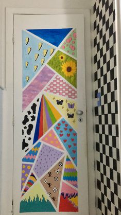 the door is decorated with many different patterns and colors, including sunflowers on it